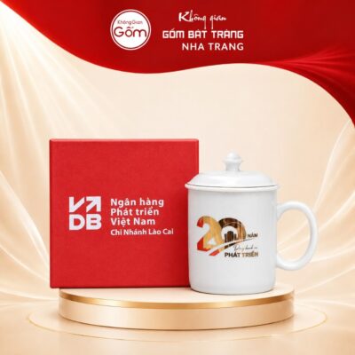 Ca Sứ Trắng In Logo Kỷ Niệm 20 Năm Phát Triển Bát Tràng Kèm Viền Chỉ Vàng - Ảnh đại diện